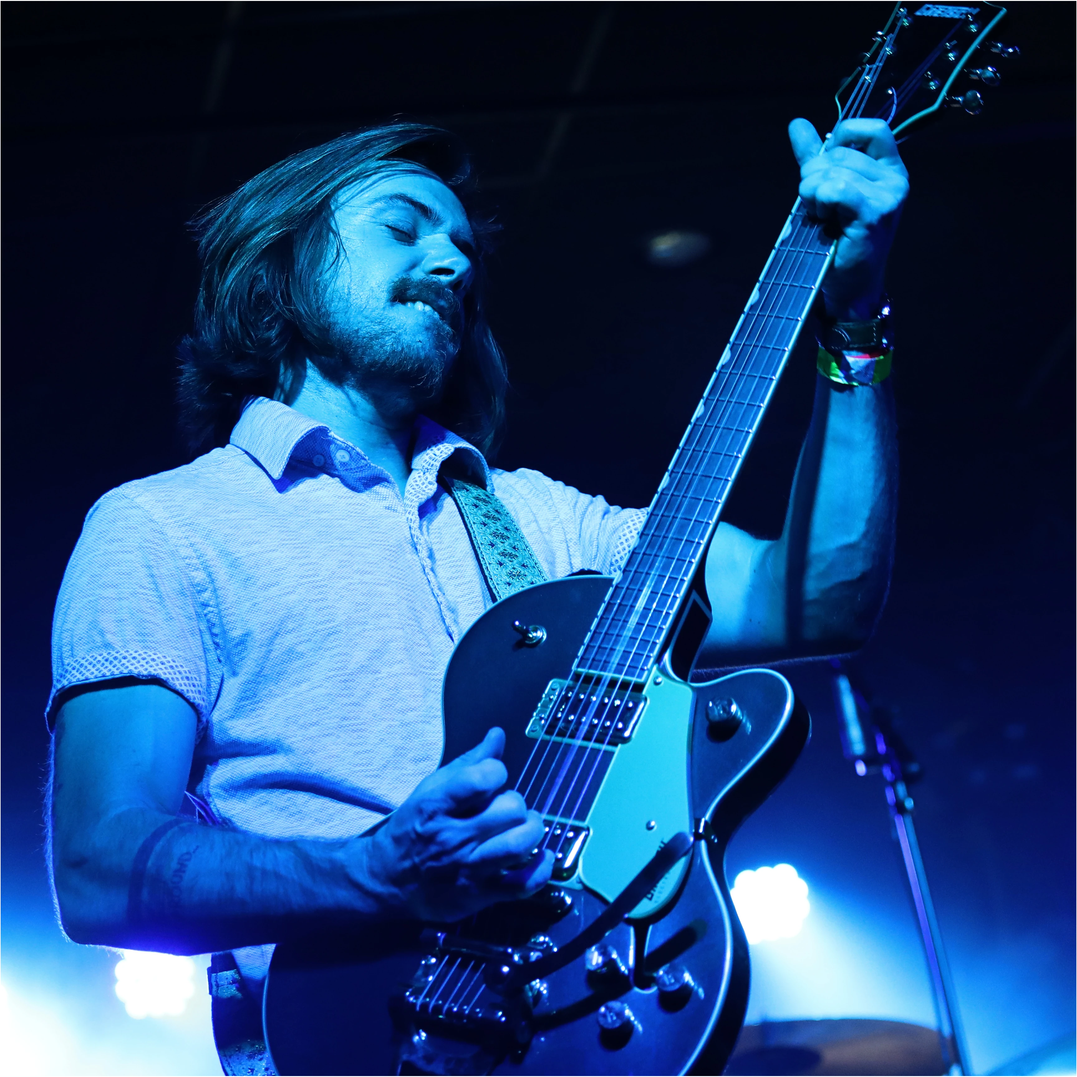 producer playing guitar